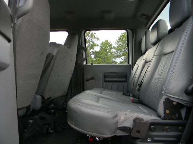 Ford F-750 Super Duty Crew Cab interior showing rear bench seat and door panel.