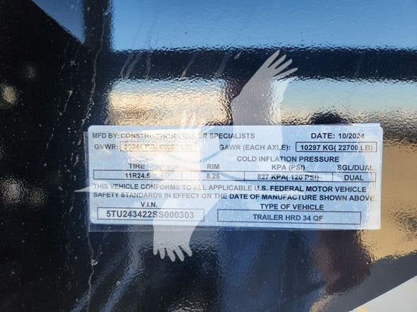 Label on trailer showing specifications: MD BY: CONTAINER SPECIALISTS; DATE: 10/2024; GVWR: 6900 KG (15212 LB); GAWR (EACH AXLE): 10297 KG (22700 LB); TIRE 11R24.5; RIM 8.25; COLD INFLATION PRESSURE: KPA 827 (120 PSI) SGL/DUAL; VIN 5TU24342