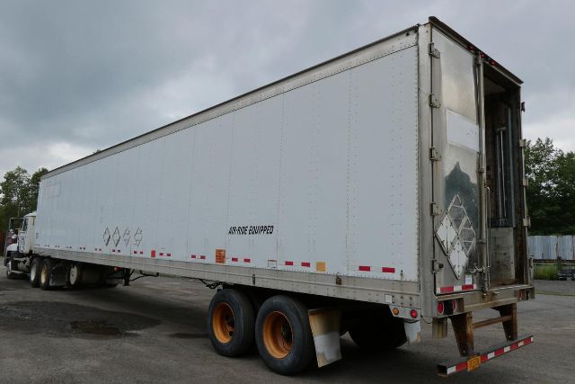 Great Dane 7311TP-SAR trailer showing side view with dual rear wheels and rear entry ramp.