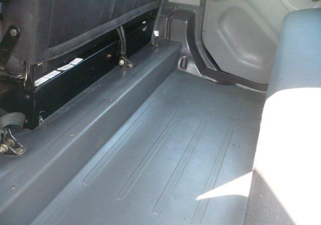 Freightliner M2 cab interior showing cabin floor and driver area.