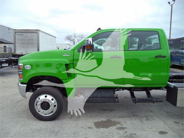 Green 2023 International CV truck side view showing wheel, steps, and driver door with black handle. VIN/stock details visible in listing text not on image.