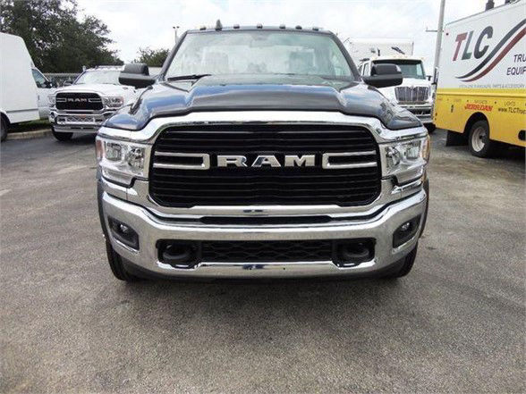 Ram 4500 pickup truck front view showing large black grille with RAM lettering, chrome bumper, and headlights in clear view.