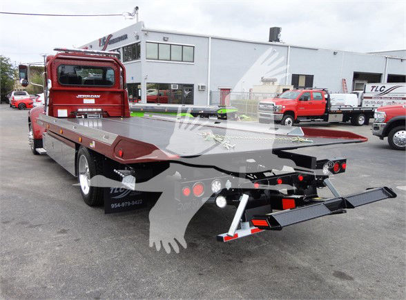Peterbilt 337 tow truck flatbed rear view showing deck and loading ramps.