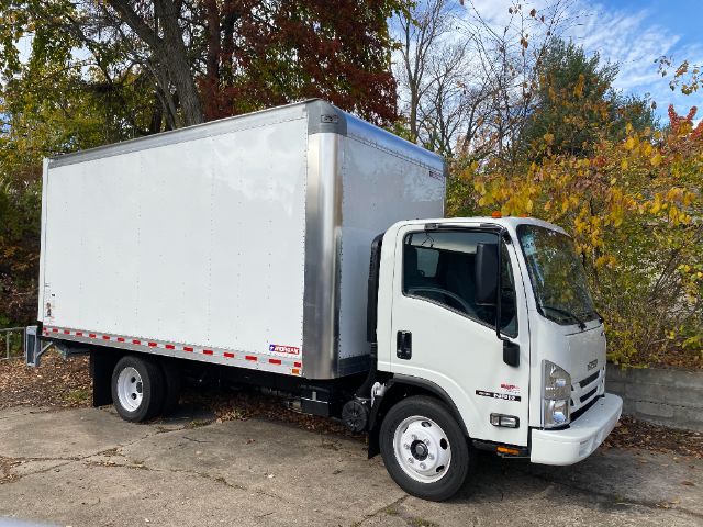 Isuzu NRR gas cab chassis with box truck body, white cab, large box cargo area, single rear axle, daylighting and surroundings.