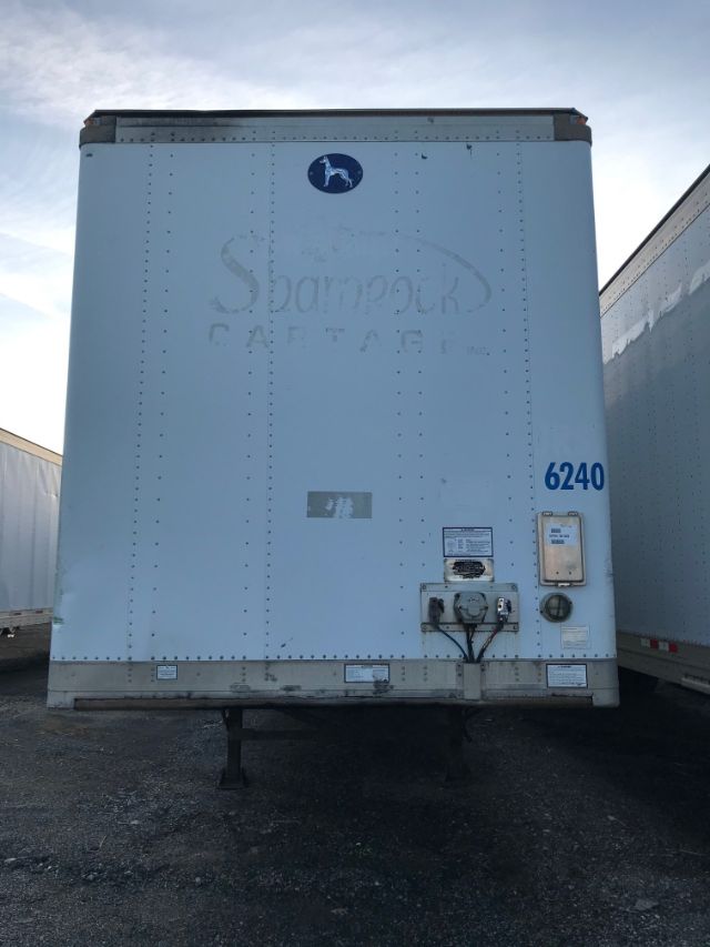 Trailer rear of a 2008 Great Dane dry van with blue fleet number 6240 and loading gear in view.