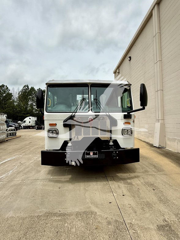 Kenworth L770 cab and chassis front view showing windshield wipers and black front bumper