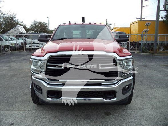 Front view of a red 2021 Ram 4500 SLT pickup truck showing RAM grille, chrome bumper, and headlights.