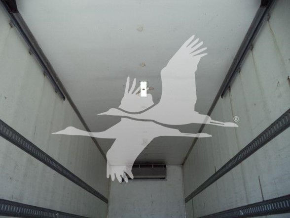 Truck trailer interior with no visible labels; overlay of seagull logo obscures center.