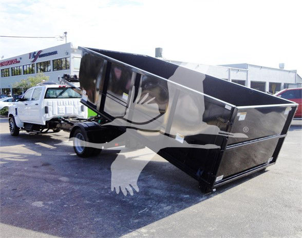 2023 Chevrolet Silverado 5500HD dump bed on a white cab chassis truck in a dealership lot.