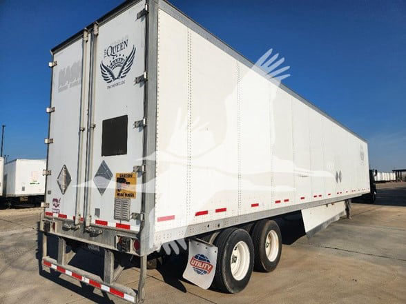 2018 Wabash van trailer with white exterior, rear doors, dual rear wheels, and Queen Logistics logo on door.
