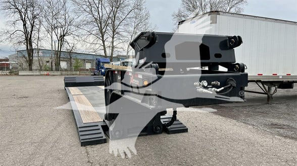 Trailer hitch platform with hydraulic ramps showing double drop expandable trailer components and hydraulic cylinders, brand markings not fully legible.