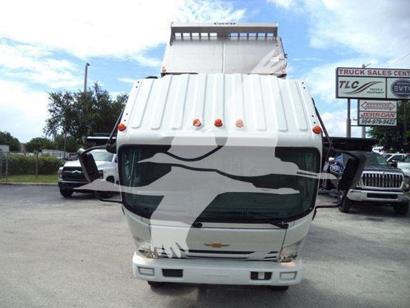 Truck front view of a white 2017 Chevrolet W4500 with camouflage graphics on the cab, vertical clearance roof, and multiple marker lights.