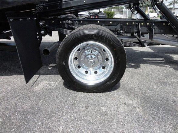 Ram 5500 chassis with single rear wheel and chrome wheel showing undercarriage components.