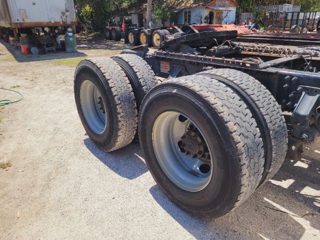 Dual rear tandem truck wheels on a Volvo VNR daycab chassis showing tires and rims.