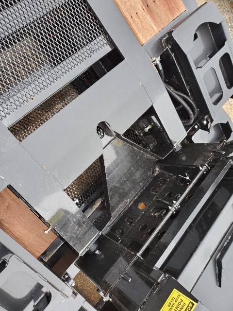 Section of a 2020 Atoka RGN-553-S lowboy trailer showing metal framework, mesh panels, and hydraulic/structural components.