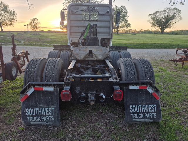 International 8600 truck rear view showing dual rear axles and mud flaps labeled SOUTHWEST TRUCK PARTS.