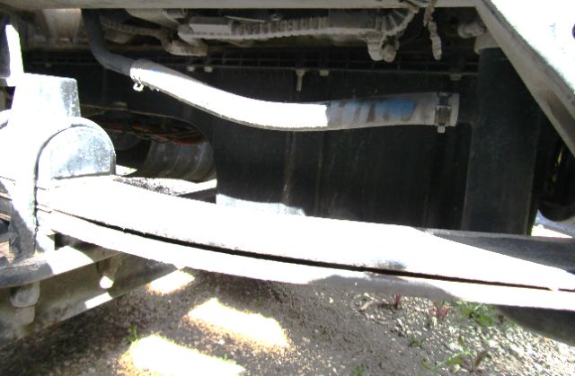Kenworth T680 front undercarriage showing dual frame rails and front bumper area.