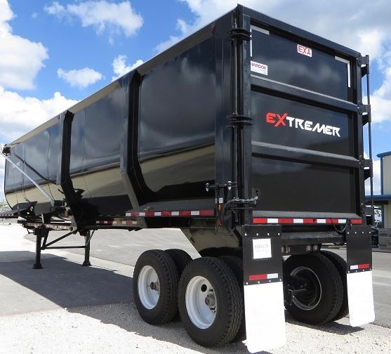 EXA 89 cubic yards scrap/demolition frameless trailer in new condition showing EXTREMER label and rear mud flaps.