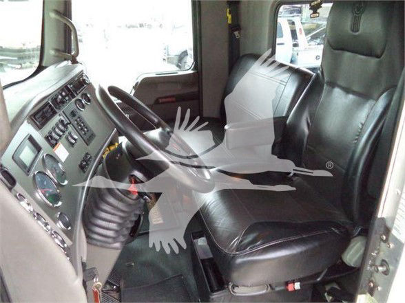 Kenworth T370 truck interior driver and passenger seats with dashboard controls visible.