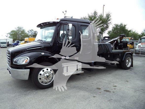 Black 2025 Freightliner BUSINESS CLASS M2 106 tow truck in a lot with stock number JU6169FM visible.