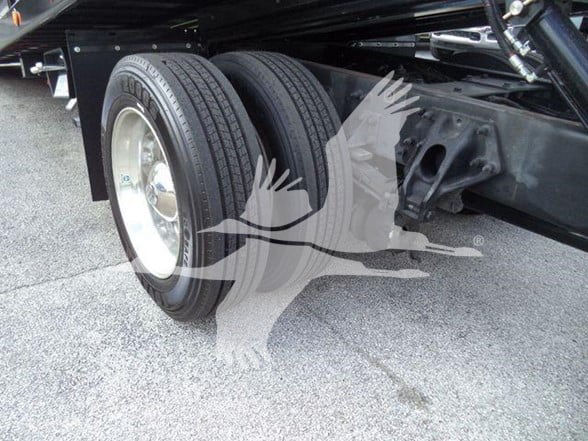 Peterbilt 337 rear dual wheels and suspension undercarriage showing tires and axle