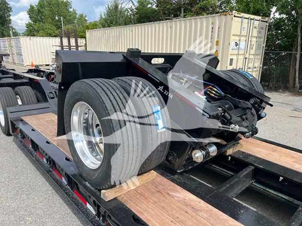 XL Specialized Xl22Fa trailer on a lowboy with a single rear axle and spare tire mounted, showing hydraulic components and deck surface.