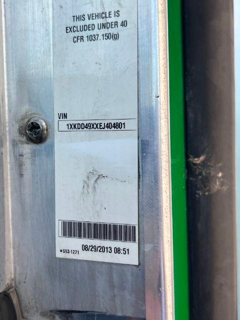 Vehicle VIN sticker on door jamb of a 2014 Kenworth T800 showing VIN 1XKD D49XXEJ404801 with barcode and date 08/29/2013 08:51, plus text ‘This vehicle is excluded under 40 CFR 1037.150(g)’