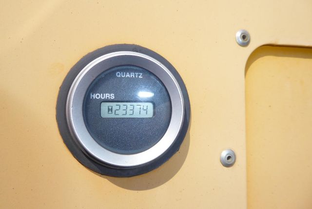 Quartz hour meter showing 23374 hours on a yellow Kalmar equipment dashboard.