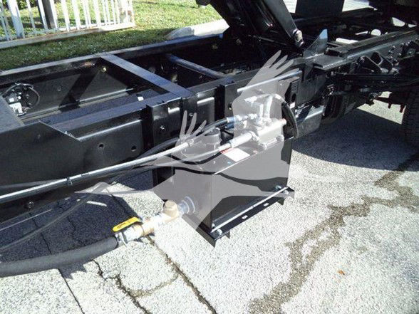 Chassis view of a 2023 Chevrolet Silverado 6500HD showing frame, hydraulic lines, and undercarriage components.