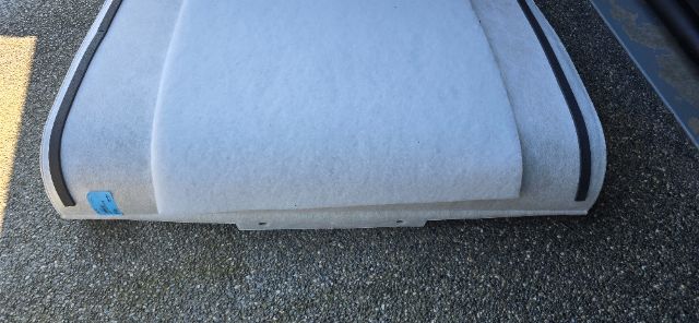 Footer of a Volvo sleeper truck part with a light gray molded surface and a small blue sticker on the left. No readable serials or part numbers visible.