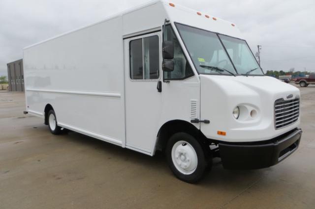 Box truck side view showing Freightliner MT45 step van with white exterior, dual rear wheels, front grille, round headlights, and side door.