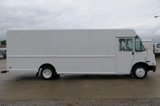 Boxy white 2008 Freightliner MT45 step van side view showing cargo box, driver door, and wheel wells.