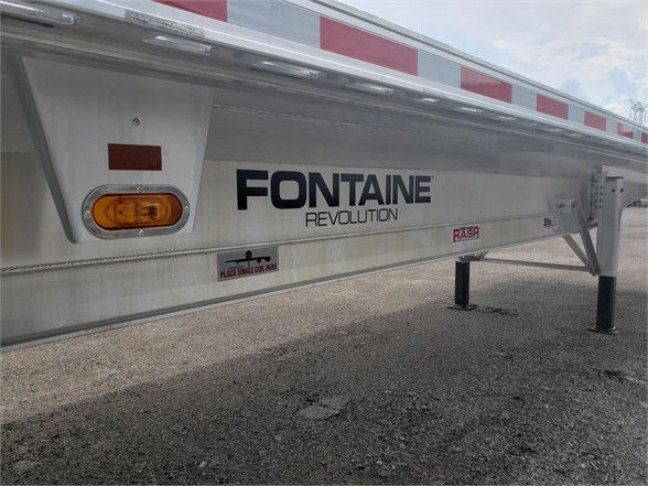  Fontaine Revolution 52 all aluminum flatbed trailer side showing brand logo and support legs.