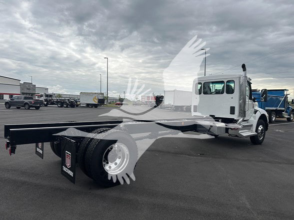 Kenworth T380 cab and chassis showing extended long wheelbase frame and dual rear axles with white cab