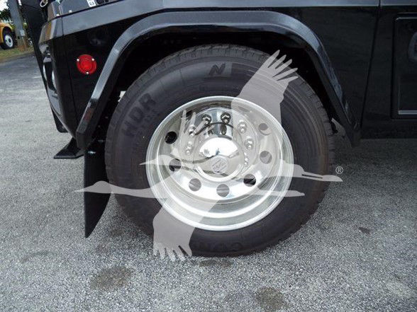 Truck front wheel and fender of a Freightliner Business Class M2 106 showing steel wheel, tire, and fender with Stock JU6169.