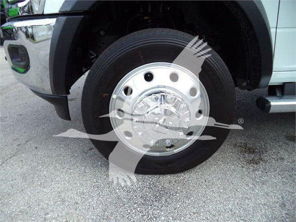 Ram 5500 wheel and chrome hubcap close-up showing front tire and wheel well.