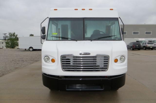 White Freightliner MT45 step van front view showing grille, headlights, and bumper.