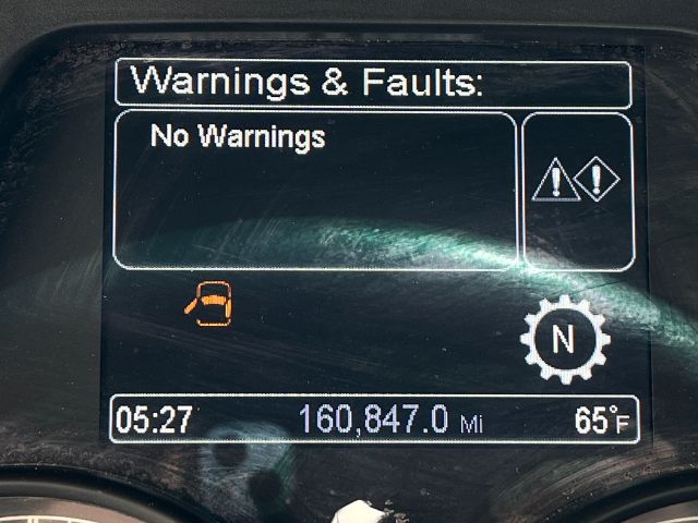 Dashboard display showing 'Warnings & Faults: No Warnings' on Peterbilt 579 instrument cluster with 160,847.0 miles, time 05:27, outside temp 65°F.