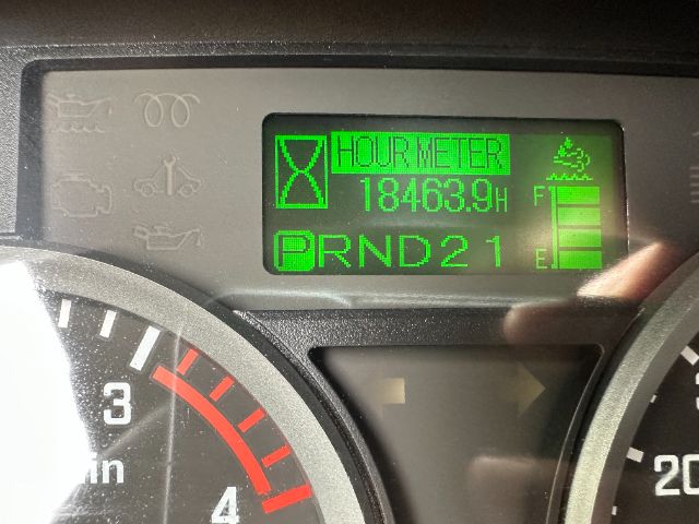 Isuzu NPR-HD dashboard showing hour meter reading 18463.9 hours and PRND2 gear indicator.