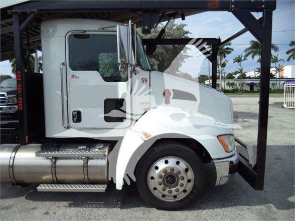 Kenworth T370 truck cab side view with wheel, fuel tank, and forklift attachment visible.