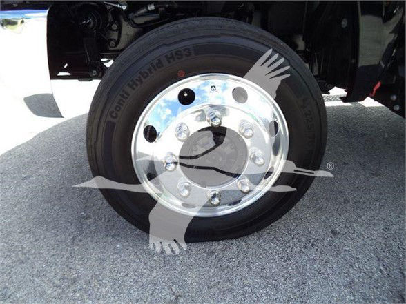 Truck wheel with chrome hub and tire. Text on tire reads 'Continental H181 HS3' or similar; wheel studs visible.
