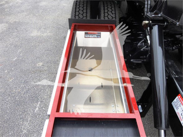 Peterbilt 337 chassis side view showing red frame with storage box and black wheel well.