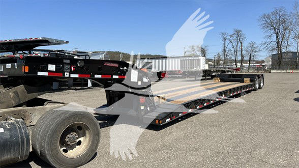 Fontaine lowboy trailer with pony motor, long flatbed, dual rear axles, VIN 13N350209T35A5590 visible in listing text; no close-up labels readable on the trailer.