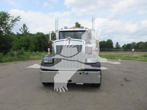 Kenworth W900B front view, chrome grille, large bumper, mirrors, and dual exhaust stacks visible.