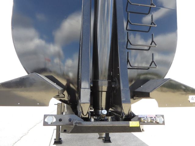 Frameless scrap/demolition trailer frame showing hitch and hydraulic components.