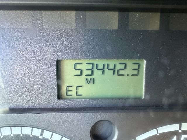 Vehicle odometer display showing 53442.3 miles with EC indicator; dashboard gauge visible.