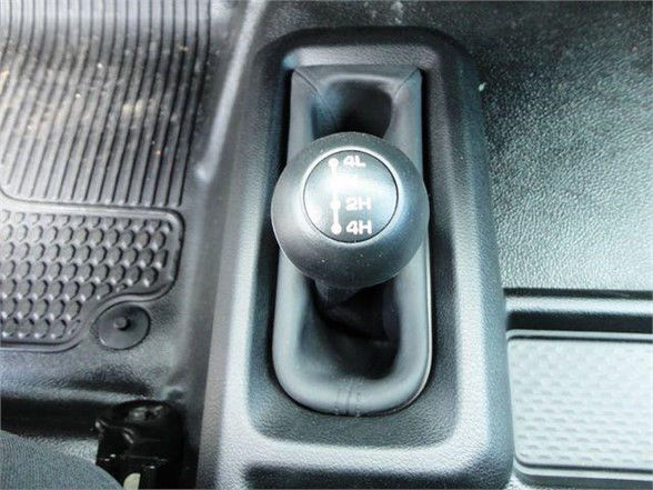 Gear shift knob showing 4x4 transfer case with 4H 2H 4H labels in a Ram 4500 interior.
