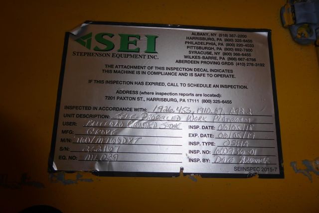 AS/EFI inspection decal on Grove T60 boom lift showing inspection details and address. Text includes COMPANY: STEPHENSON ENT INC. with contact numbers and unit description etc.