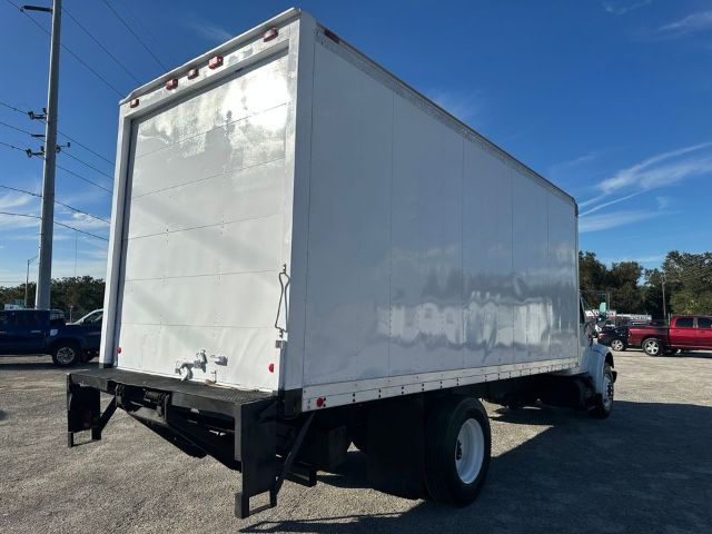 Box truck with a white cargo box and cab, rear and side views visible, VIN plate not legible, used 1997 International 4700.