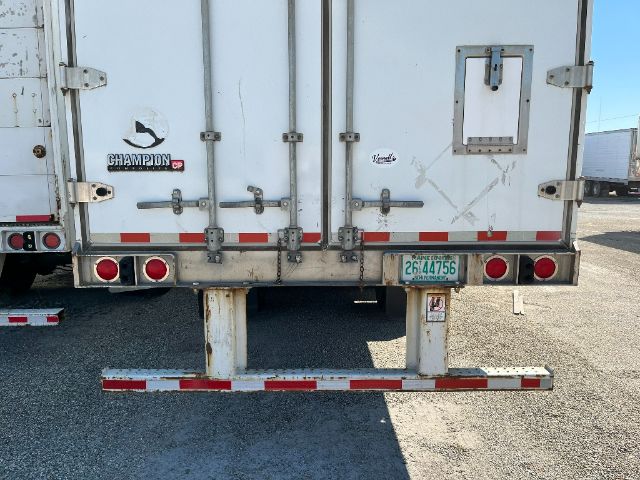 Champion trailer rear showing doors, lights, and bumper with license plate 2G44756.
